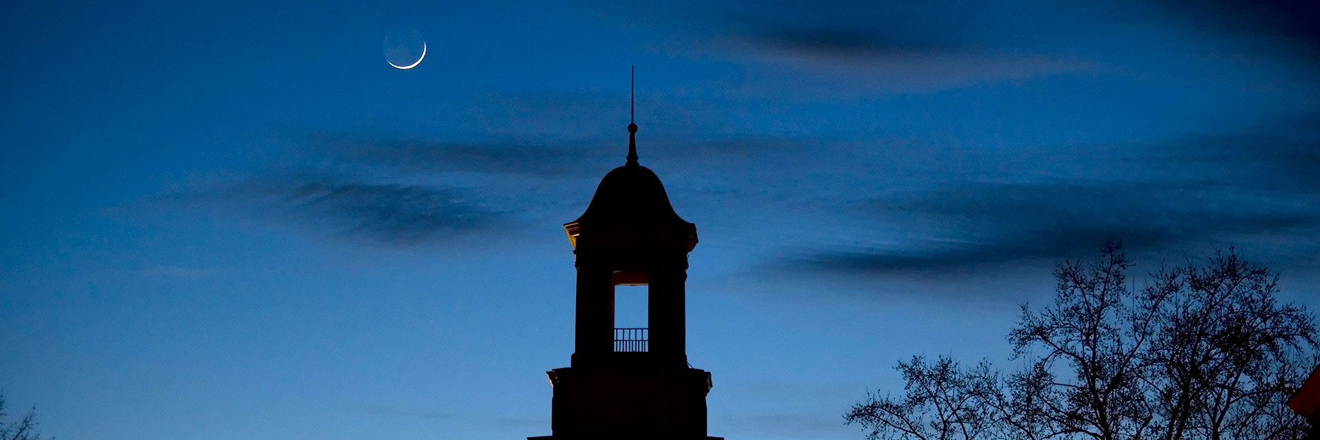cupola at dusk with sliver moon header